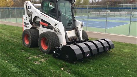 caterpillar skid steer aerator attachment